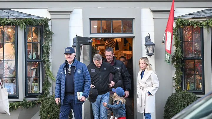 a group of people walking into a store